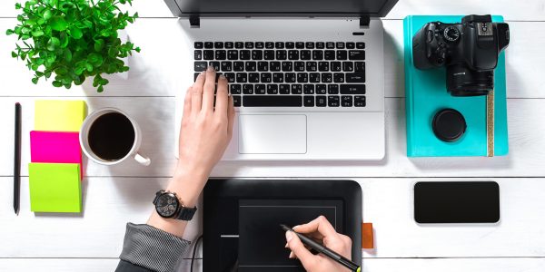 Overhead view of businesswoman working at computer in office. Place for your text. Ideal for blog. flat lay on white background